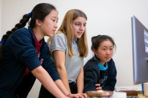 Stratford School middle school students work on programming computer games as part of their coding curriculum